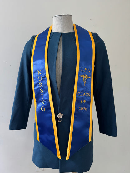 A Blue With Gold Trim LPN graduation stole with royal blue trim, showcasing bold 'LPN ' lettering embroidered at the top, followed by a medical logo and 'CLASS OF 2026' embroidered beneath. The stole has slanted tips and a white plain background. All characters are embroidered.